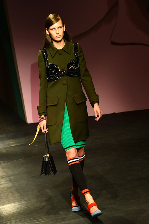 OVER THE TOP | Prada's gals wore long-sleeve jumpers and coats emblazoned with bras in spring 2014 runway show